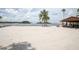Relaxing sandy beach with picnic area and calm water at 2749 Plantain Dr, Holiday, FL 34691