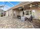 Spacious screened patio with seating area and lovely backyard view at 2749 Plantain Dr, Holiday, FL 34691