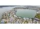 Aerial view of waterfront neighborhood with various house styles at 306 180Th E Ave, Redington Shores, FL 33708