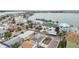 Aerial view of a waterfront community with colorful houses and boats at 306 180Th E Ave, Redington Shores, FL 33708
