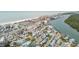 Aerial view of beach front neighborhood with waterway access at 306 180Th E Ave, Redington Shores, FL 33708