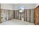 Unfinished bathroom with exposed pipes and framing at 306 180Th E Ave, Redington Shores, FL 33708