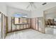 Unfinished bedroom with tiled floor and walls at 306 180Th E Ave, Redington Shores, FL 33708
