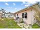 Side of a pink house with AC unit and some building materials at 306 180Th E Ave, Redington Shores, FL 33708