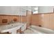 Unfinished kitchen with exposed framing and wiring at 306 180Th E Ave, Redington Shores, FL 33708