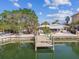 Aerial view of waterfront home with private dock and lush landscaping at 370 59Th Ave, St Pete Beach, FL 33706