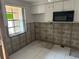 Renovation in progress, new kitchen cabinets and microwave at 4366 Summersun Dr, New Port Richey, FL 34652