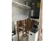 Unfinished laundry area with exposed pipes and water heater at 4366 Summersun Dr, New Port Richey, FL 34652