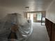 Living room with walls and floors under construction, partially covered at 4366 Summersun Dr, New Port Richey, FL 34652