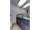 Bathroom with dark vanity and tile backsplash at 4455 Duhme Rd # 304, St Petersburg, FL 33708
