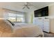 Bright bedroom with large TV, dresser, and comfortable bed at 4455 Duhme Rd # 304, St Petersburg, FL 33708