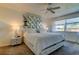 Spacious bedroom with ceiling fan and large window at 4455 Duhme Rd # 304, St Petersburg, FL 33708