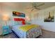 Bedroom with a queen bed, Eiffel Tower art, and teal accents at 4455 Duhme Rd # 304, St Petersburg, FL 33708