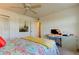 Bedroom with a queen bed, desk, and Eiffel Tower art at 4455 Duhme Rd # 304, St Petersburg, FL 33708
