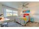 Bedroom with a queen bed, desk, and colorful decor at 4455 Duhme Rd # 304, St Petersburg, FL 33708