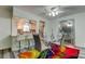 Open concept dining area with kitchen view, and colorful rug at 4455 Duhme Rd # 304, St Petersburg, FL 33708
