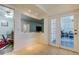 Open dining area with view into kitchen and sunroom at 4455 Duhme Rd # 304, St Petersburg, FL 33708