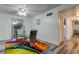 Bright dining area with glass table, white chairs, and colorful rug at 4455 Duhme Rd # 304, St Petersburg, FL 33708