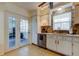 Kitchen with view into sunroom and stainless steel appliances at 4455 Duhme Rd # 304, St Petersburg, FL 33708