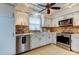 Clean kitchen, featuring stainless steel appliances and white cabinets at 4455 Duhme Rd # 304, St Petersburg, FL 33708
