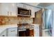 Modern kitchen featuring stainless steel range and microwave at 4455 Duhme Rd # 304, St Petersburg, FL 33708