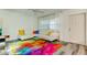 Living room with white sectional sofa and colorful rug at 4455 Duhme Rd # 304, St Petersburg, FL 33708