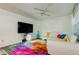Bright living room with white sectional sofa and colorful rug at 4455 Duhme Rd # 304, St Petersburg, FL 33708