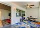 Sunroom with windows, ceiling fan, and access to another room at 4455 Duhme Rd # 304, St Petersburg, FL 33708