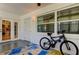 Relaxing sunroom with access to the outdoors and a mountain bike at 4455 Duhme Rd # 304, St Petersburg, FL 33708