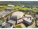 Aerial view of a large stadium and parking area at 5041 Sunridge Palms Dr # 103, Tampa, FL 33617