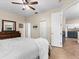 Bright bedroom with a view of the kitchen and access to the bathroom at 5041 Sunridge Palms Dr # 103, Tampa, FL 33617