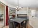 Bright dining area with access to a patio and a view of the bedroom at 5041 Sunridge Palms Dr # 103, Tampa, FL 33617