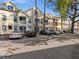 Tan two-story building with ample parking and mature trees at 5041 Sunridge Palms Dr # 103, Tampa, FL 33617