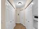 Bright hallway with multiple storage closets and tile flooring at 5041 Sunridge Palms Dr # 103, Tampa, FL 33617