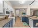 Modern kitchen with blue cabinets, granite countertops, and stainless steel appliances at 5041 Sunridge Palms Dr # 103, Tampa, FL 33617