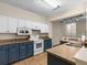 Two-toned kitchen with granite countertops and white cabinets at 5041 Sunridge Palms Dr # 103, Tampa, FL 33617