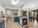 Modern kitchen with blue cabinets, granite countertops, and stainless steel appliances at 5041 Sunridge Palms Dr # 103, Tampa, FL 33617