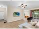 Bright and airy living area with a view of the patio at 5041 Sunridge Palms Dr # 103, Tampa, FL 33617