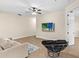 Spacious living room with a large TV and comfortable seating at 5041 Sunridge Palms Dr # 103, Tampa, FL 33617