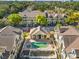 Community pool and spa with surrounding apartments at 5041 Sunridge Palms Dr # 103, Tampa, FL 33617