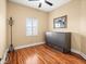 Small bedroom with hardwood floors and a murphy bed at 5301 Gulf Blvd # D610, St Pete Beach, FL 33706