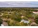 Aerial view of single Gathering home with pool and lush landscaping at 531 Garrard Dr, Temple Terrace, FL 33617