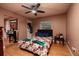 Bedroom with floral bedding and a ceiling fan at 531 Garrard Dr, Temple Terrace, FL 33617