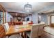 Elegant dining room with chandelier and view into living room at 531 Garrard Dr, Temple Terrace, FL 33617