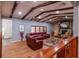 Living room boasts hardwood floors, exposed beams, and a fireplace at 531 Garrard Dr, Temple Terrace, FL 33617