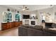 Spacious living room with a stone fireplace and large sectional sofa at 6020 Kestrel Point Ave, Lithia, FL 33547