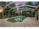 Inviting screened pool and spa with a spacious patio at 6020 Kestrel Point Ave, Lithia, FL 33547