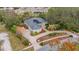 House with solar panels and landscaped yard; long driveway at 6114 Kingbird Manor Dr, Lithia, FL 33547