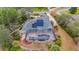 House with solar panels and screened-in pool; spacious backyard at 6114 Kingbird Manor Dr, Lithia, FL 33547