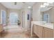Elegant bathroom featuring a soaking tub, shower, and double vanity at 6114 Kingbird Manor Dr, Lithia, FL 33547
